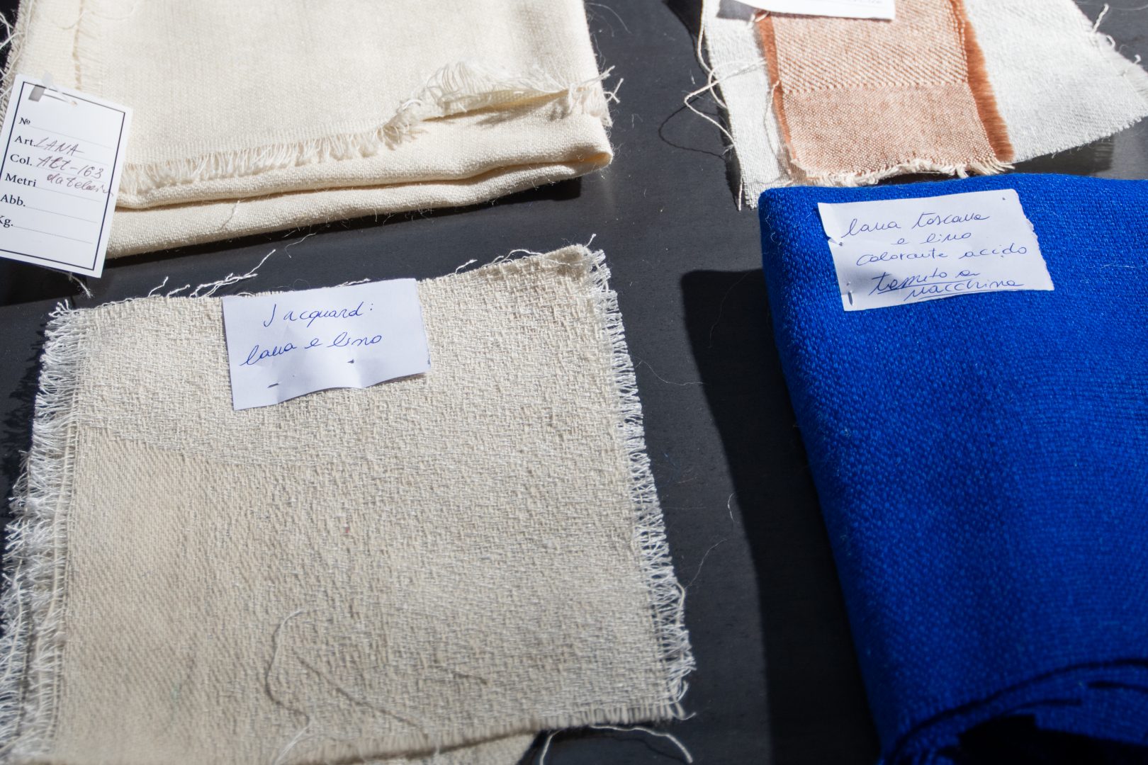 Sampling of different quality fabrics of natural fiber composition which are woven on dobby looms by manufacturers in the district’s area. Photo: Rachele Salvioli