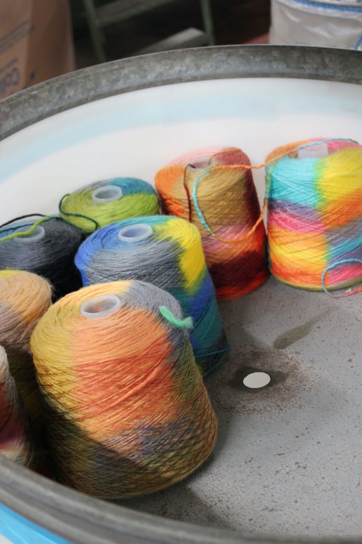 Drying yarns treated with space-dye technology. Photo: Rosa Sonntag