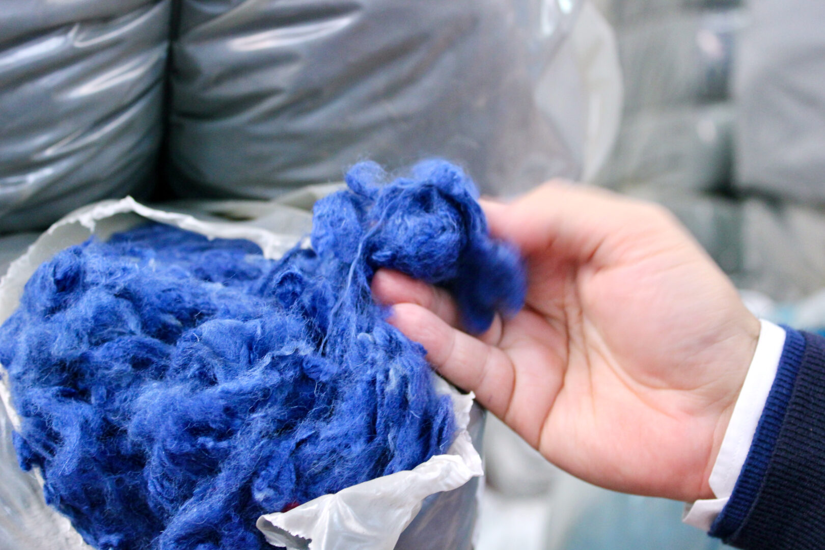 Evaluation of fibers before the carding process in a local spinning mill. Carded yarns made of regenerated wool are a typical product of the the textile district and have a long standing history. Photo: Rosa Sonntag